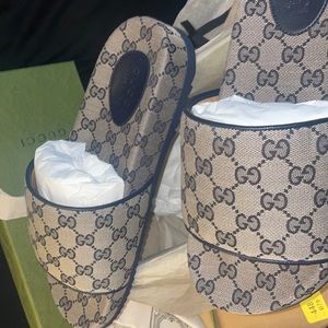 Brand new , still in box Gucci men’s slides size 11. It has the authenticity tag